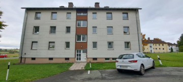Außenansicht - Attraktives Immobilienpaket mit viel Potenzial: 12 MFH in Brunnenthal (Nähe Hof) – 52 WE – Grst. 19.168 m²